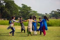 Children enjoying blind manÃ¢â¬â¢s bluff game in the open field. Teenagers or young girls playing blind manÃ¢â¬â¢s bluff game